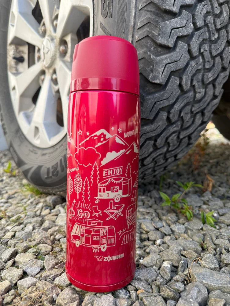 Pouring from the Zojirushi SJ-JS red stainless steel thermos flask, ideal for outdoor use in Ireland