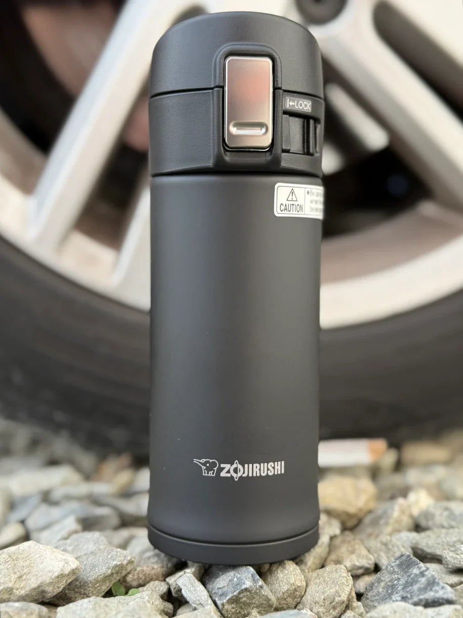 Zojirushi SM-PDX black insulated travel mug attached to bicycle lifestyle photo