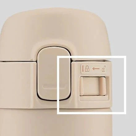 Zojirushi SM-PD beige travel mug lid close-up with removable sealing parts for easy cleaning