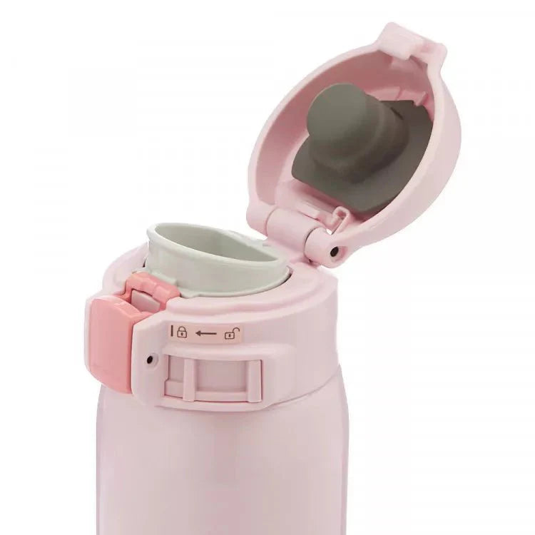 Zojirushi SM-SR pink insulated travel mug open lid showing drinking spout interior
